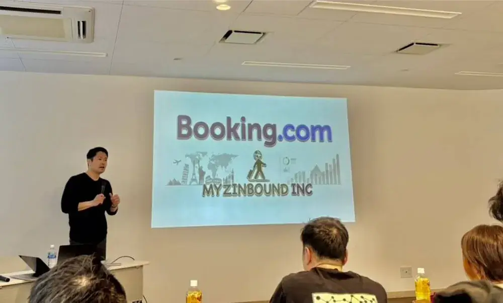 Booking.com主催セミナーで登壇する代表 松根